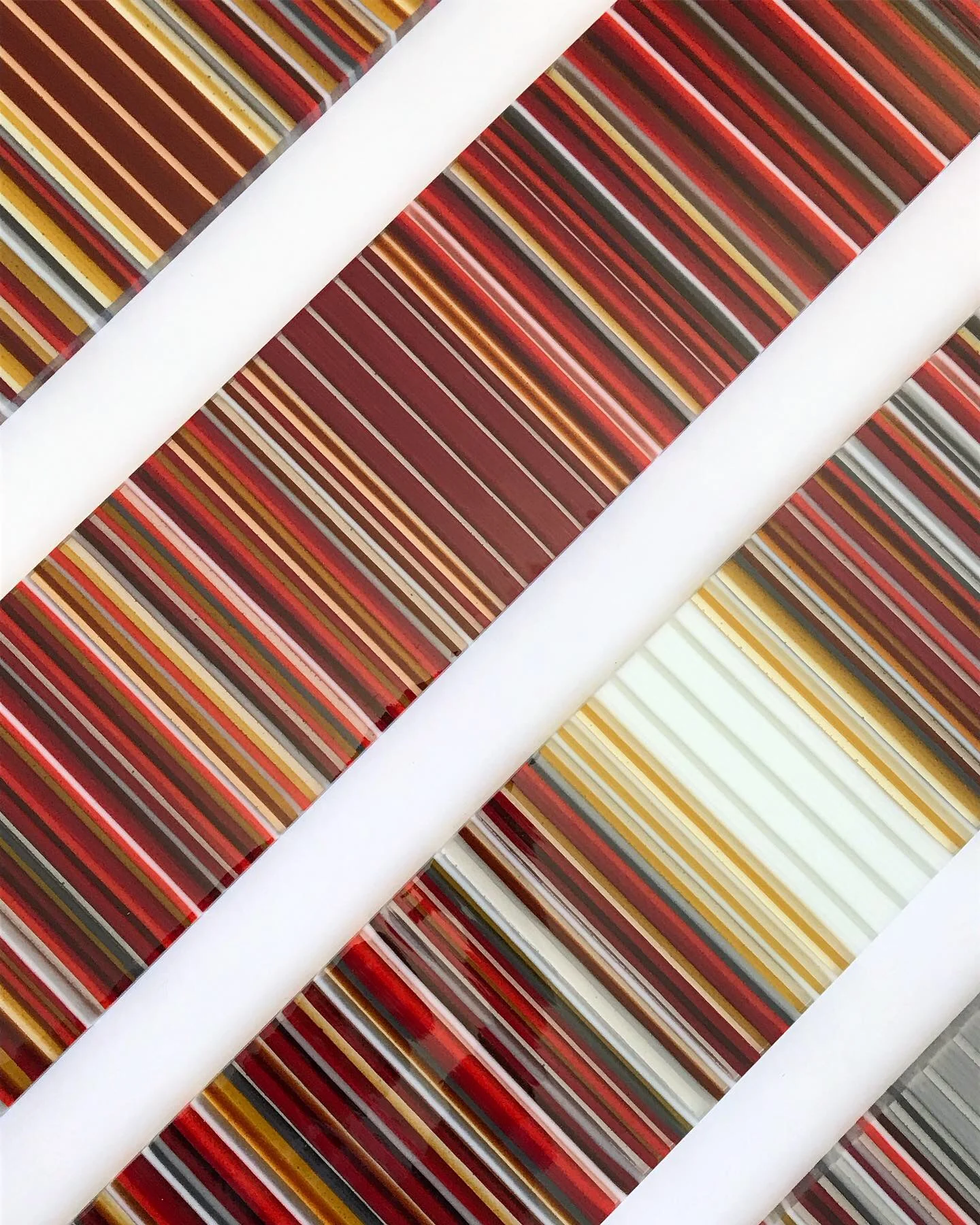 Close view of red, orange and white glass stripes